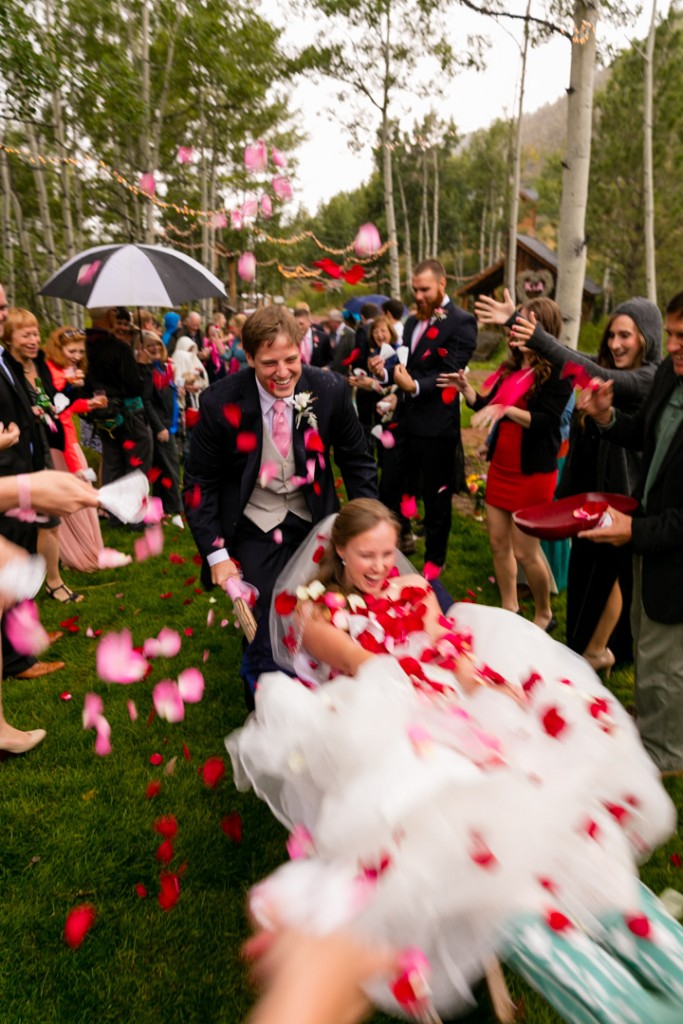 Rose petals thrown at bride and groom