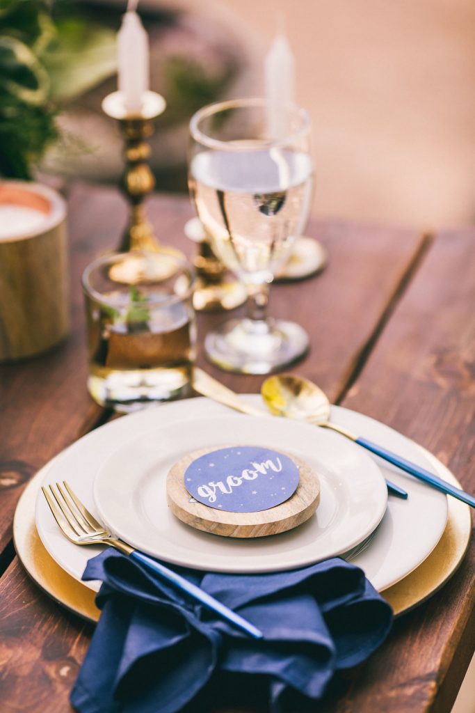 Layers place setting with gold and wood pieces 