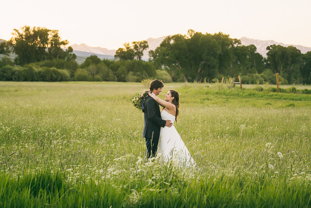 Bride and Groom in a field