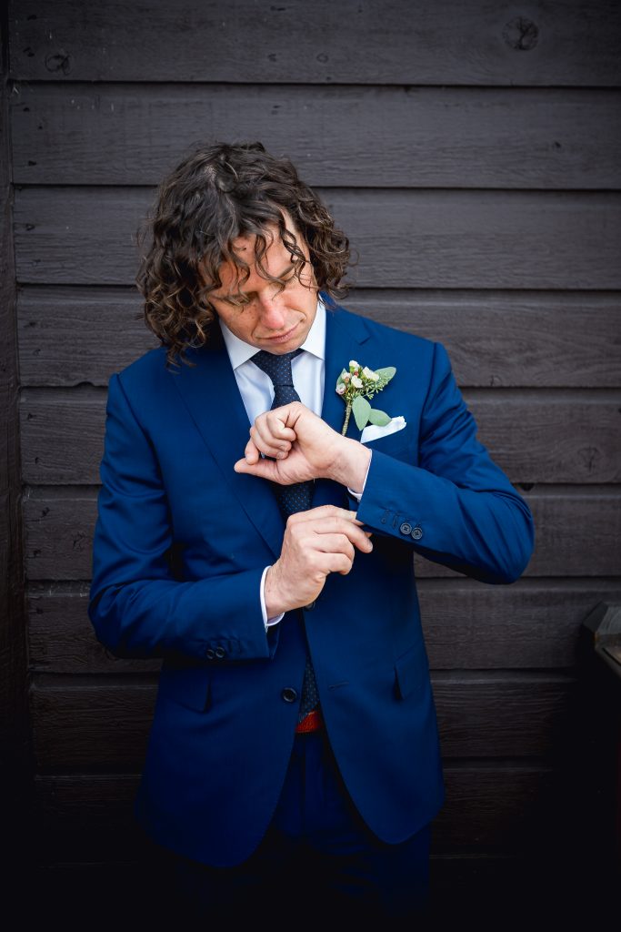 Groom in a blue suit and navy tie