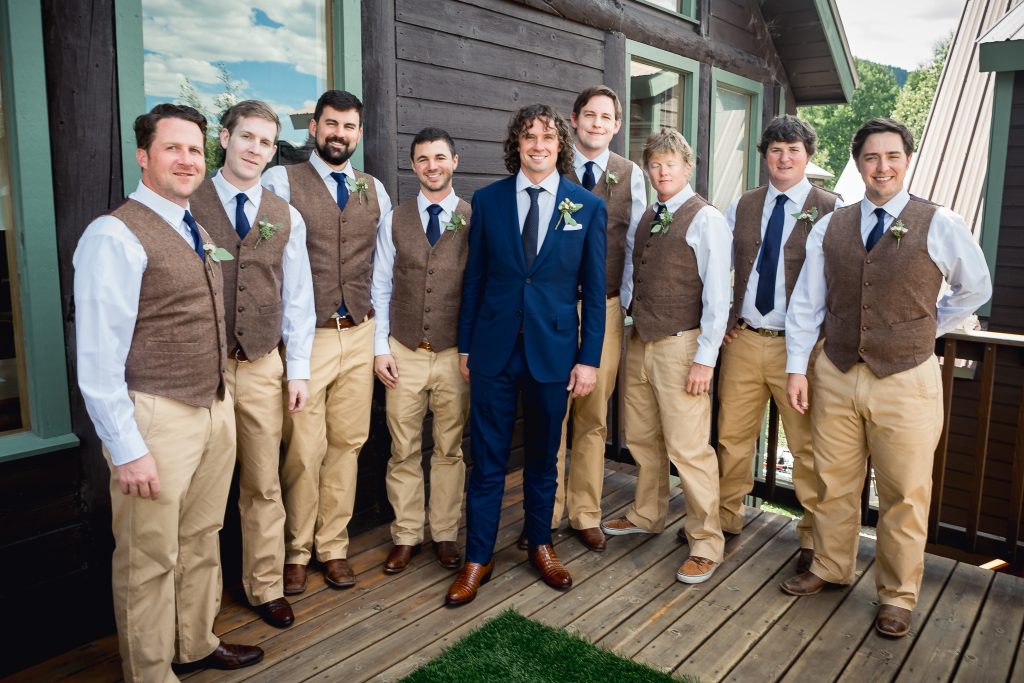 groomsmen in tan pants and brown vest