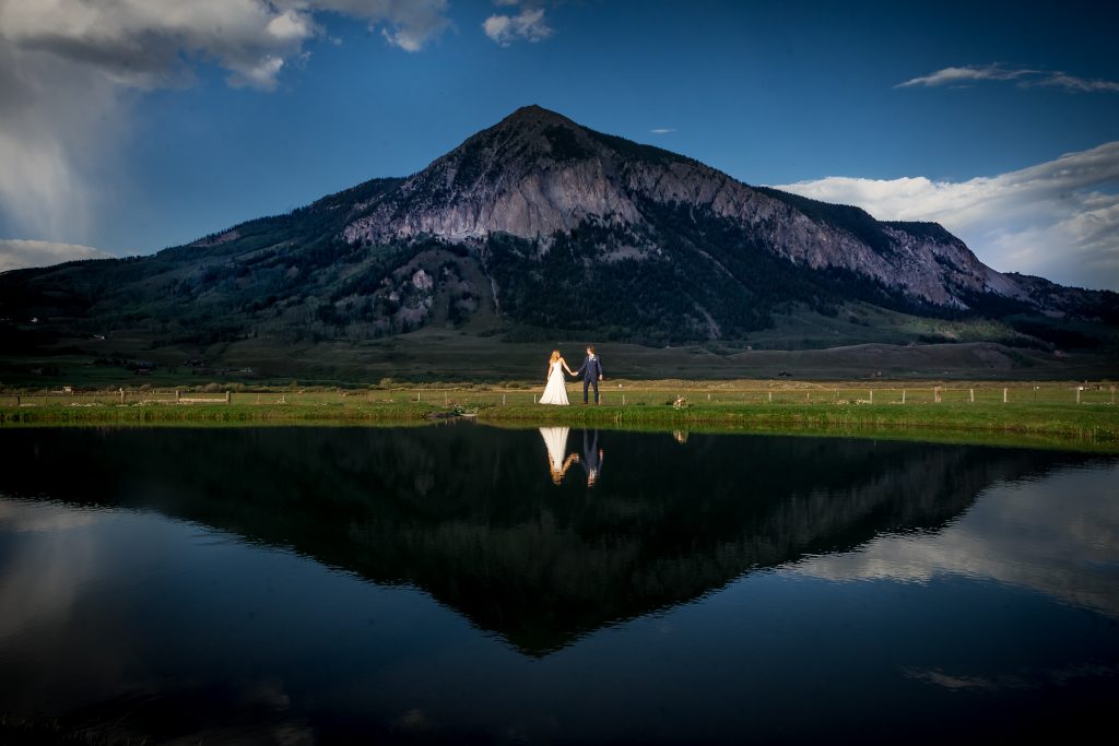 newlyweds in front of the peak of Crested Butte mountain
