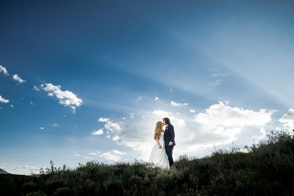 Crested Butte bride and groom under a sunset