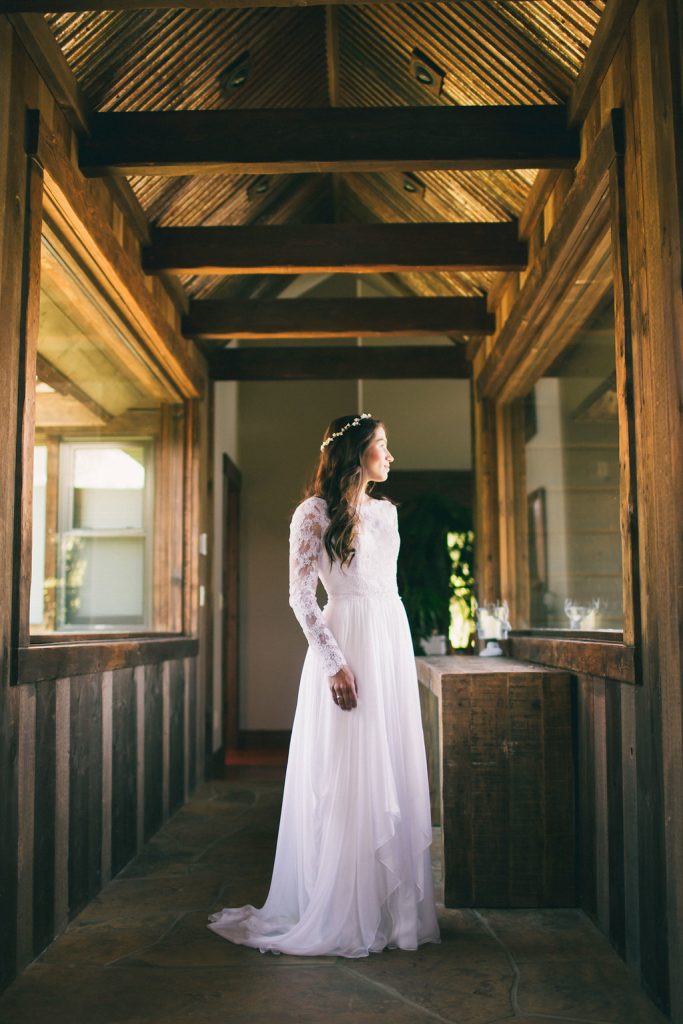 Bride in long sleeve lace dress