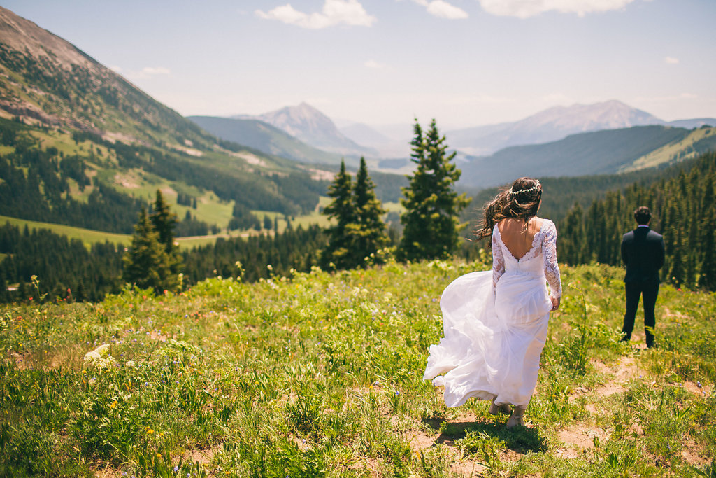 Bride walking down for the mountain top first look