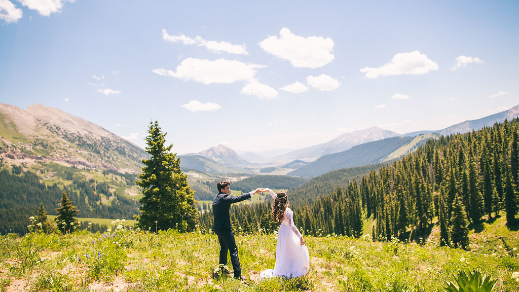 Bride and groom on top of a mountain