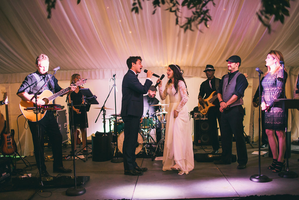 bride and groom sing their first dance song