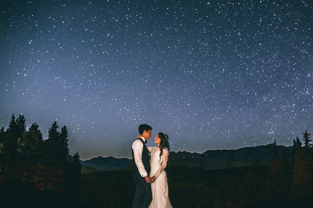 Bride and groom under the night sky