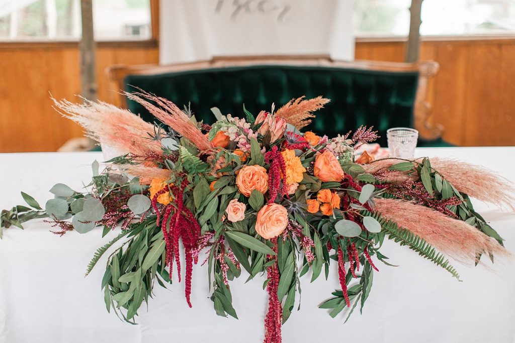 Devon + Billy Mountain Wedding Garden sweetheart table florals