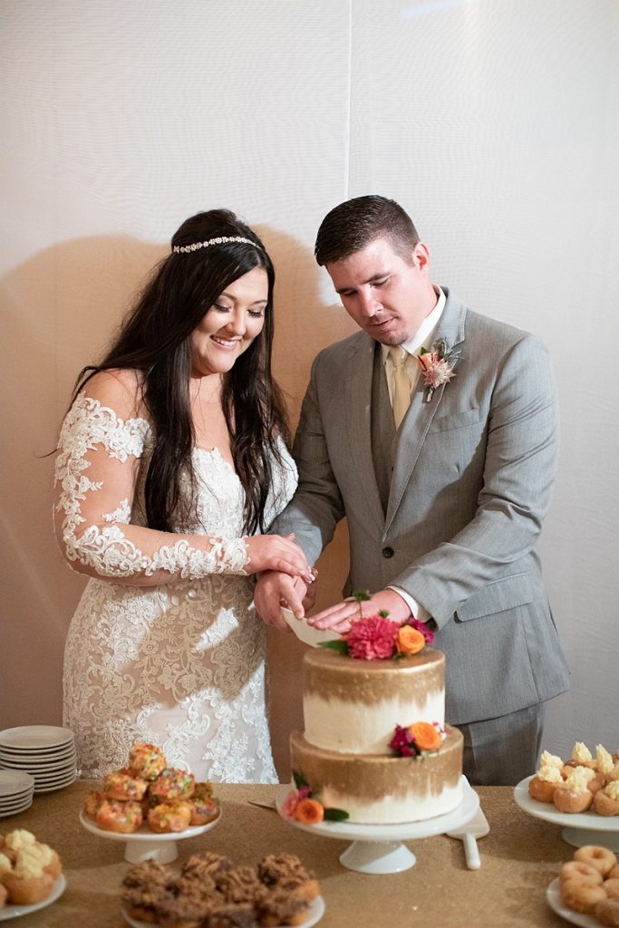Devon + Billy Mountain Wedding Garden wedding cake cutting