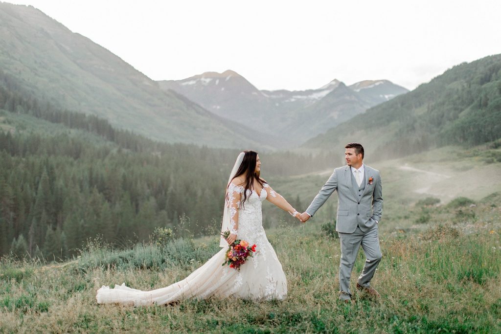 Devon + Billy Mountain Wedding Garden bride and groom with mountains in the background